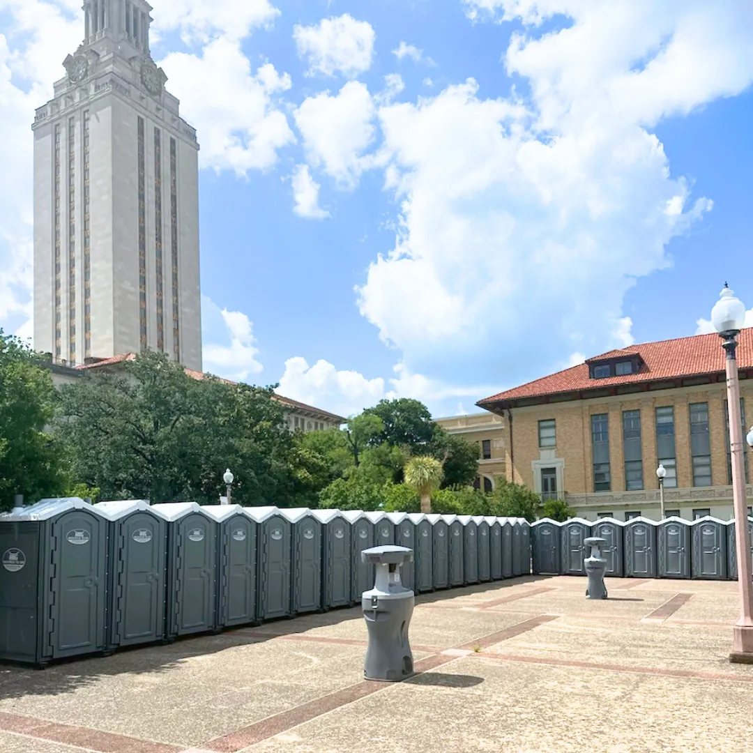 Row of portable restrooms at an outdoor event
